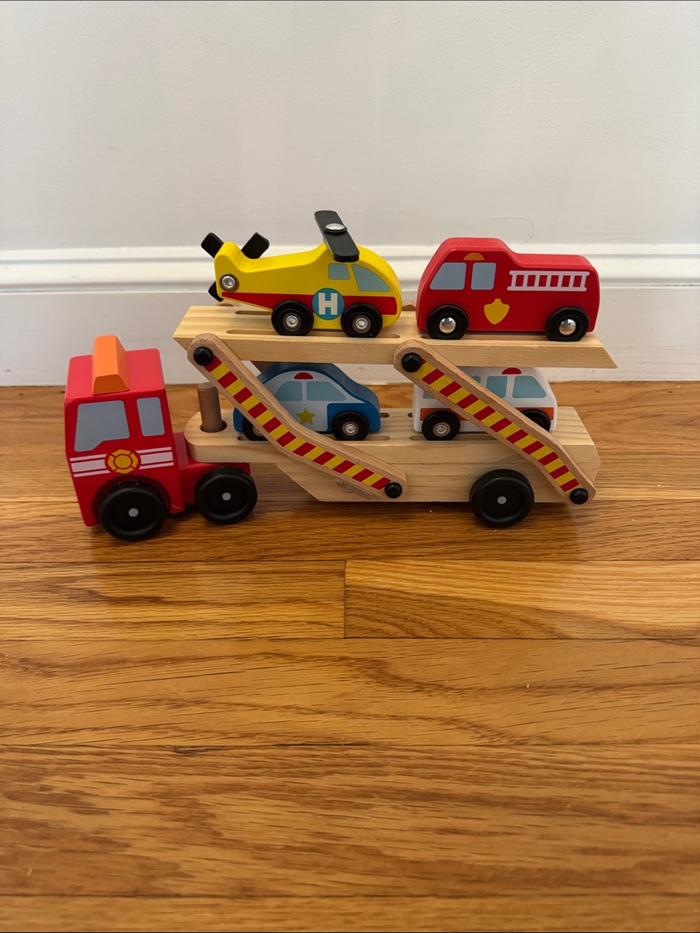 Melissa & Doug emergency vehicle carrier wooden truck with 4 vehicles